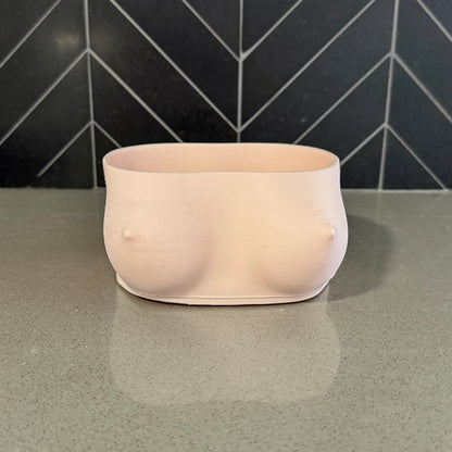 Topless female torso bowl by Peckers Co, side angle view on a kitchen counter