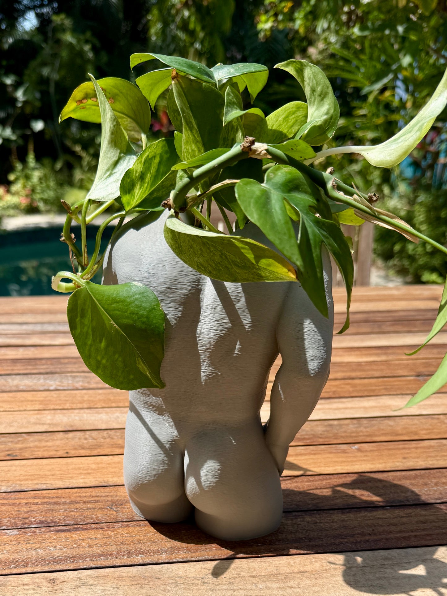 The Father Figure dad bod torso planter, three-quarter view